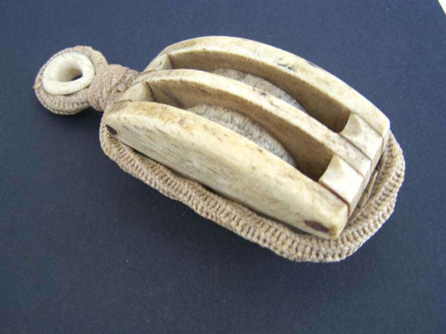 A 19th century ANTIQUE Whalebone 'Double' Ships' Block with whalebone grommet and fancy ropework
